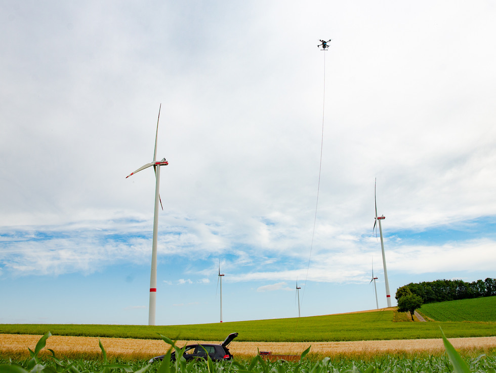 A tethered drone is operated in a windpark